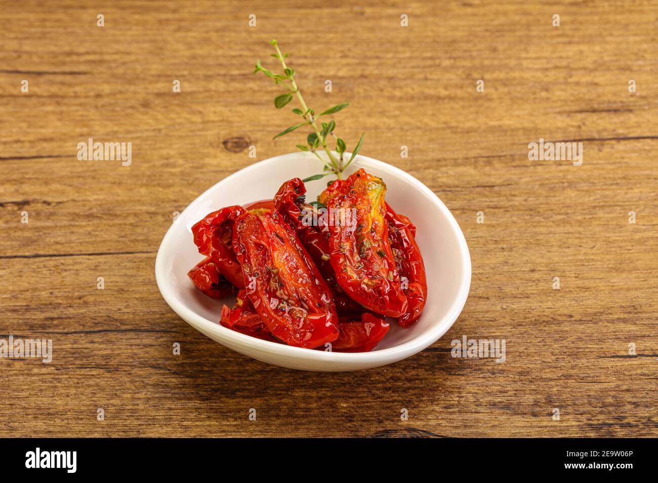 Sundried tomato in olive oil with herbs and spices Stock Photo Alamy