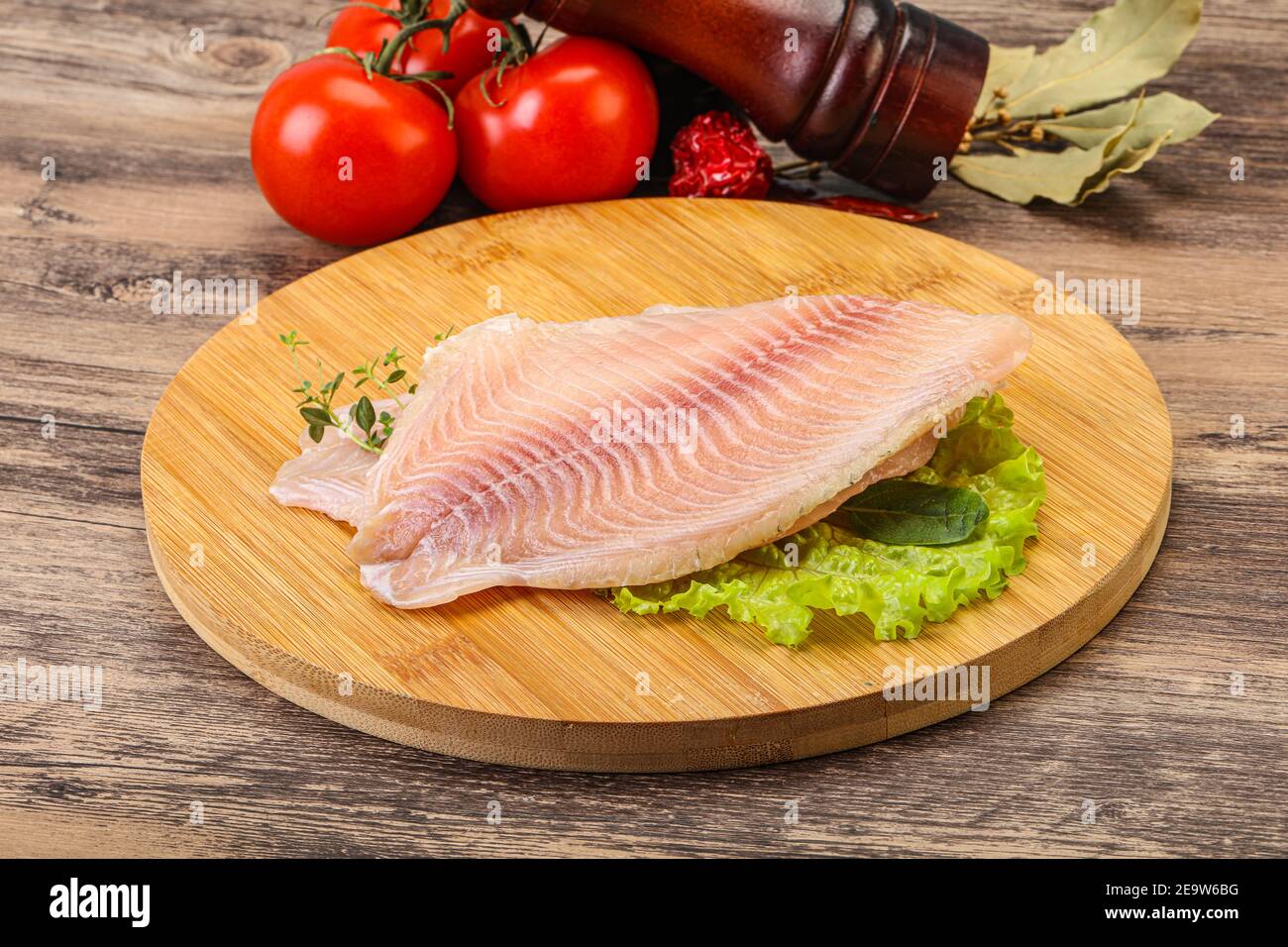 Raw tilapia fish fillet for cooking Stock Photo Alamy