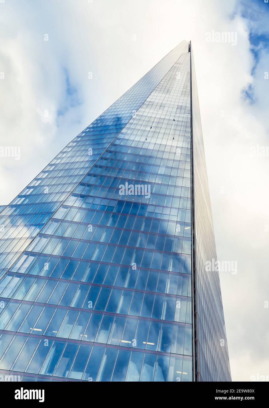 LONDON, UK - July 03, 2013. The Shard. Blue sky reflected on the glass exterior of a landmark skyscraper in central London, UK Stock Photo