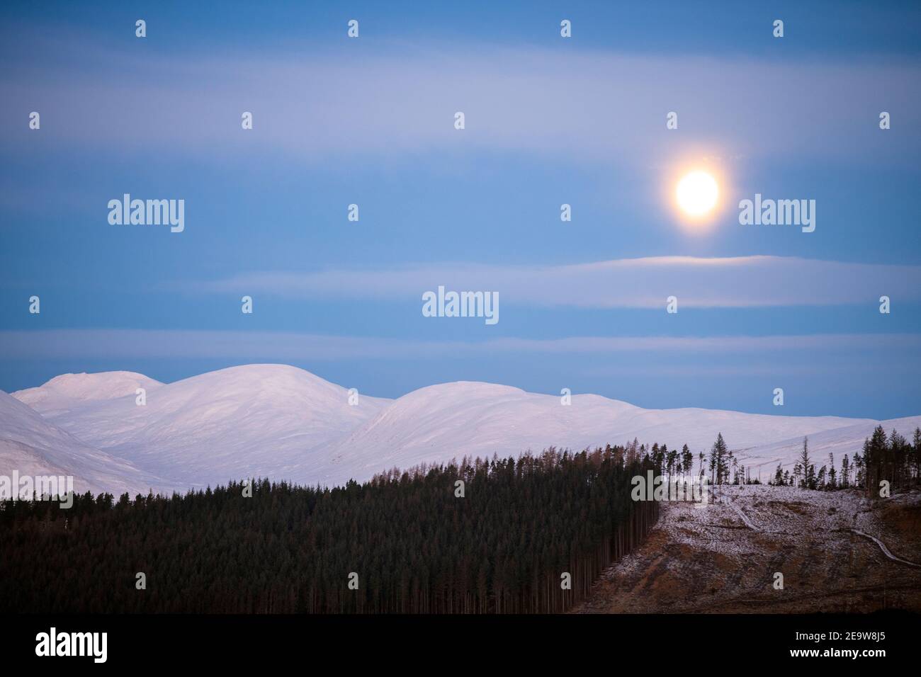 Full Moon over Snowy Mountains, Scotland. Stock Photo