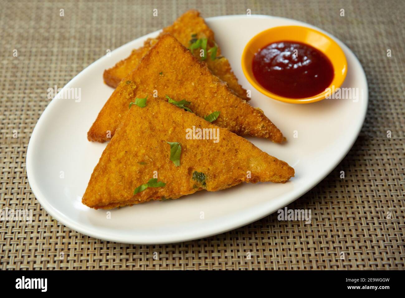 Popular Indian Nepali snacks Bread Pakoda with tomato ketchup on the