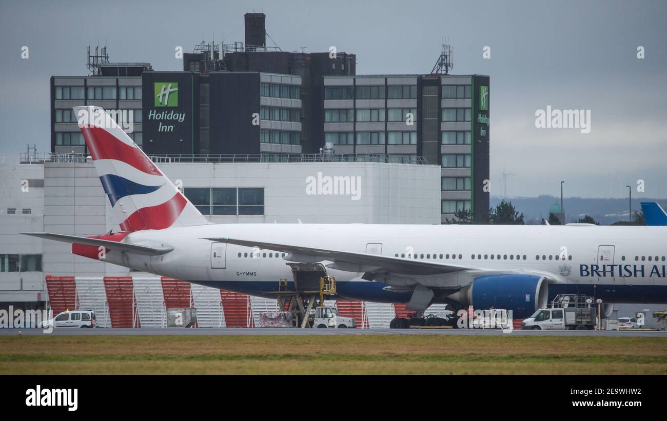 Glasgow, Scotland, UK. 6th Feb, 2021. Pictured: A special cargo flight: a British Airways Boeing 777-236ER (reg G-YMMS) which arrived from Bangkok Flt no BA3580 last night carrying supplies of PPE into Glasgow, and is now being loaded back up with more cargo before departing for London Heathrow. A rare sight at Glasgow Airport but especially during the coronavirus (COVID19) pandemic where passenger numbers have fallen dramatically and a number of airlines have either gone bust or are taking a brief hiatus in order to save cash. Credit: Colin Fisher/Alamy Live News Stock Photo