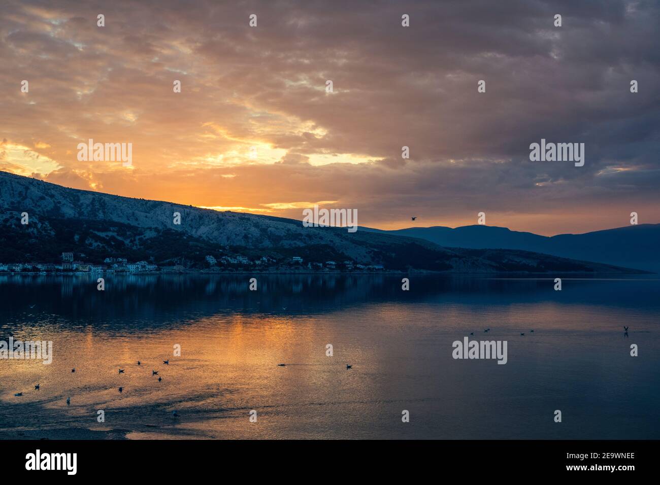 Sunlight at dawn on the Adriatic sea. View from the bay of Baska. Island Krk. Croatia. Europe. Stock Photo