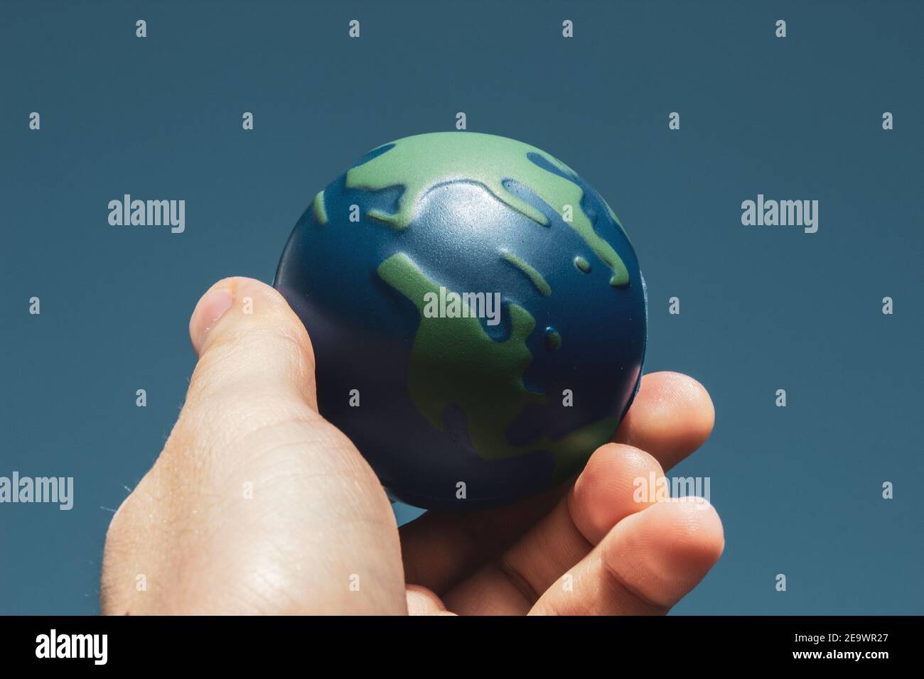 Earth Day. Male hand holding earth in his hands. Human saving planet earth. There is no planet b concept. Earth day concept. Protecting the world is i Stock Photo