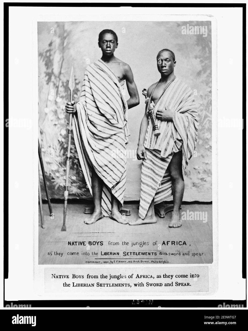 Native boys from the jungles of Africa, as they come into the Liberian settlements, with sword and spear Stock Photo