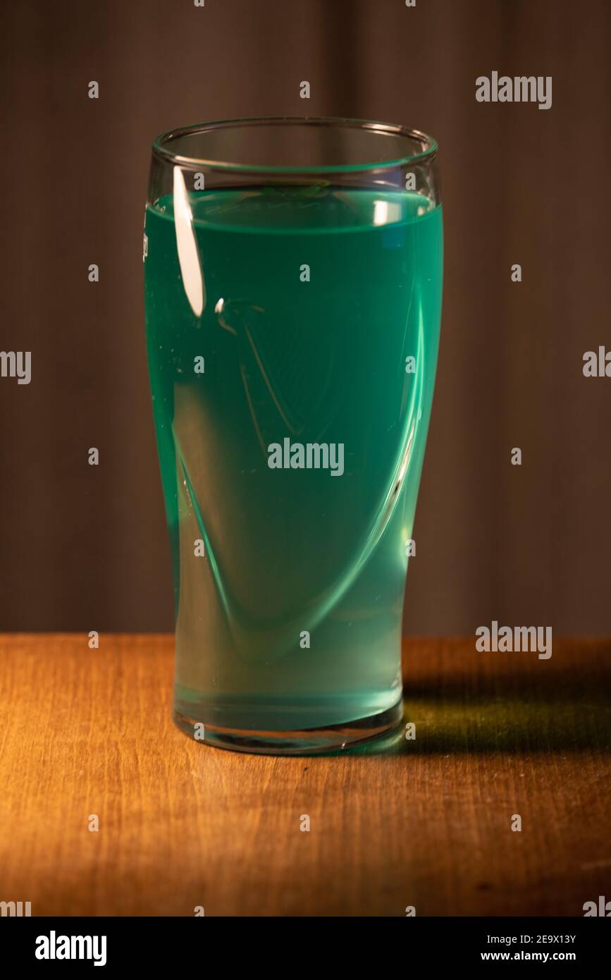 A glass of delicious craft beer served on an authentic beer glass, to be used as a background. Stock Photo