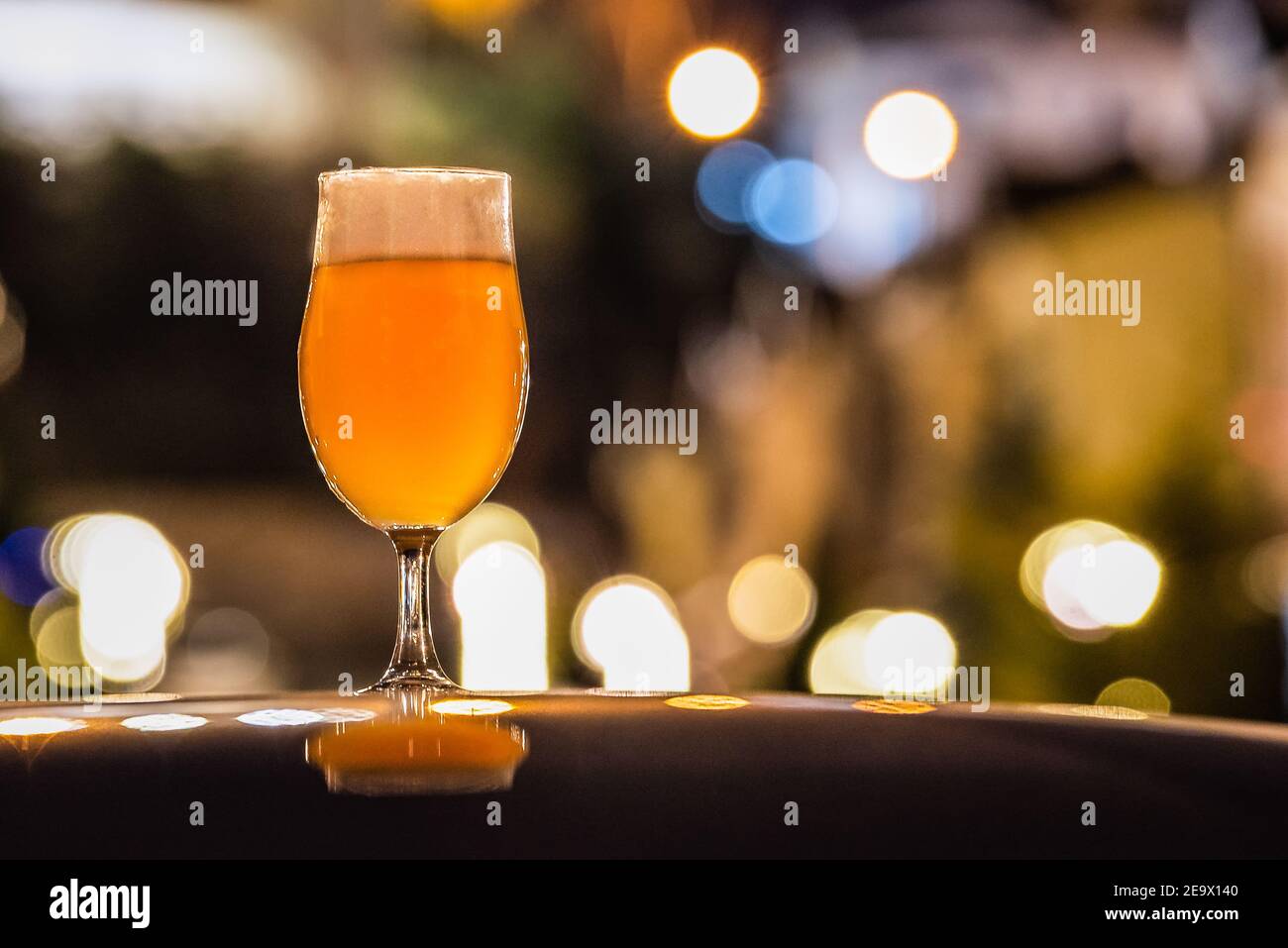 A glass of delicious craft beer served on an authentic beer glass, to