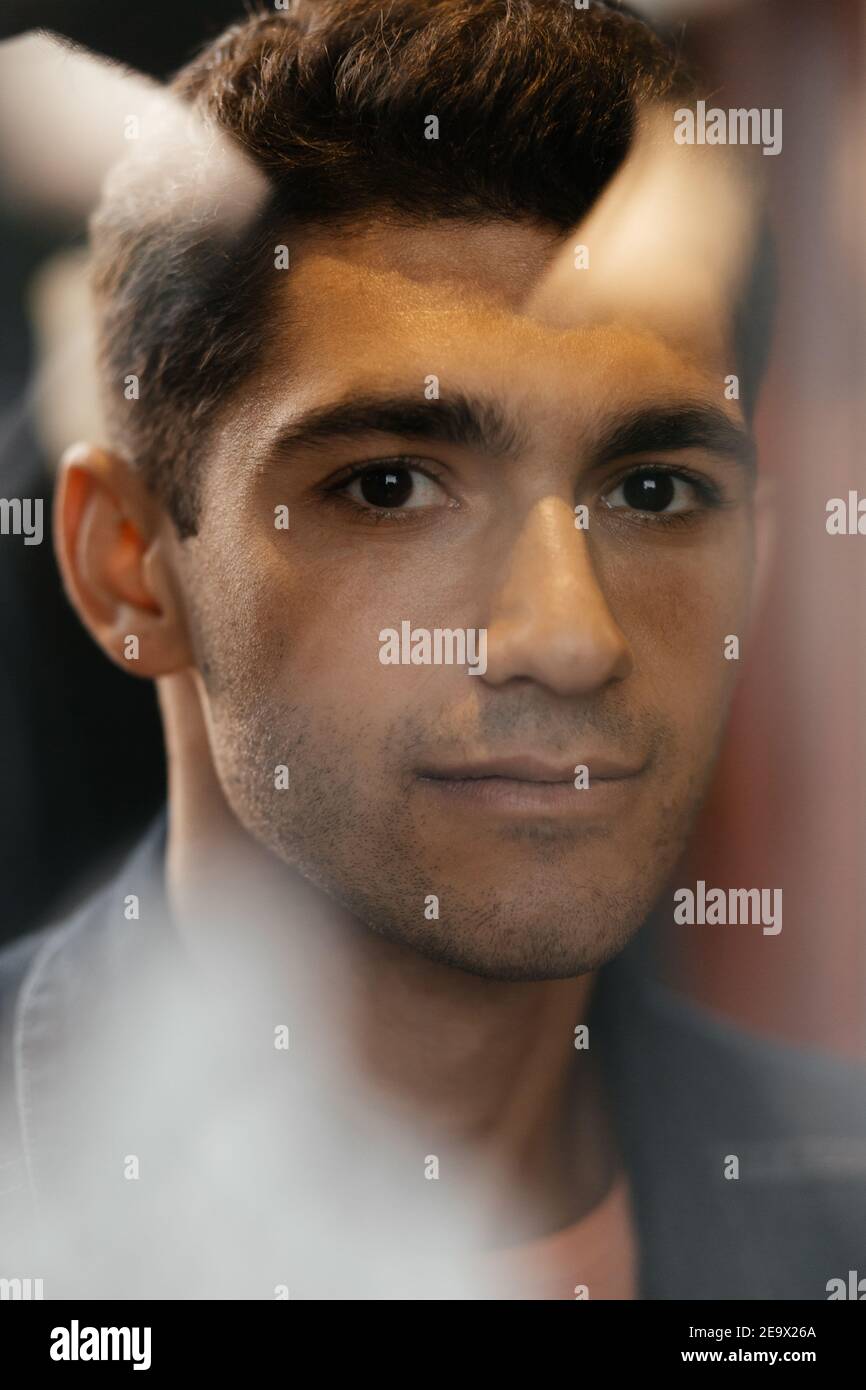 Cheerful man looking straight. Close up portrait of handsome brunette. Stock Photo