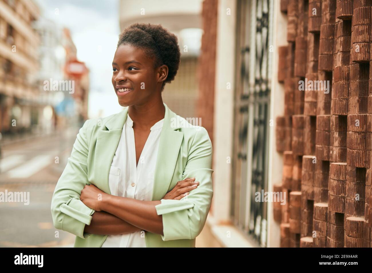 Young african american businesswoman with crossed arms smiling happy at ...