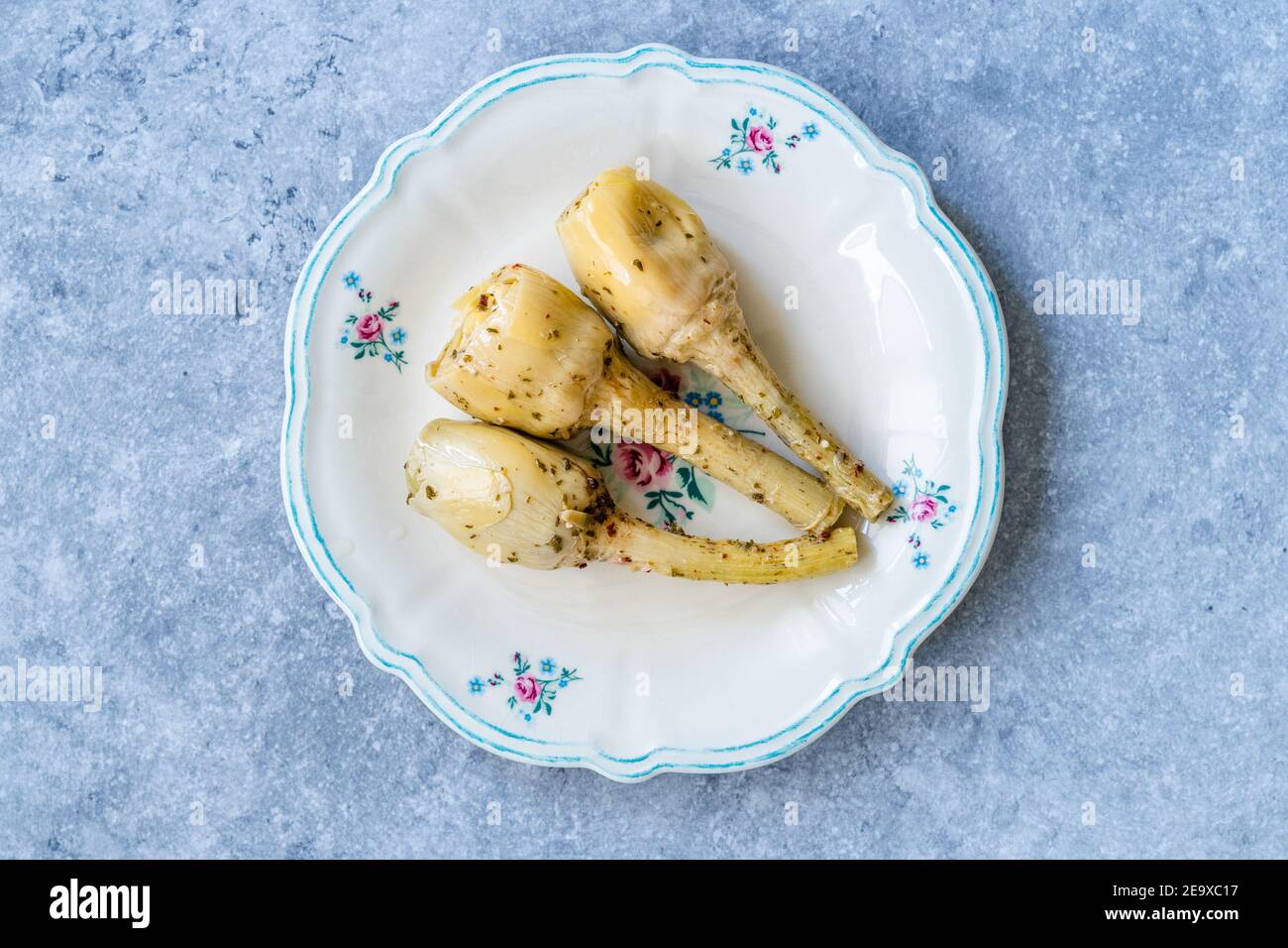 Marinated Spicy Artichoke Hearts in Olive Oil served with Root. Ready