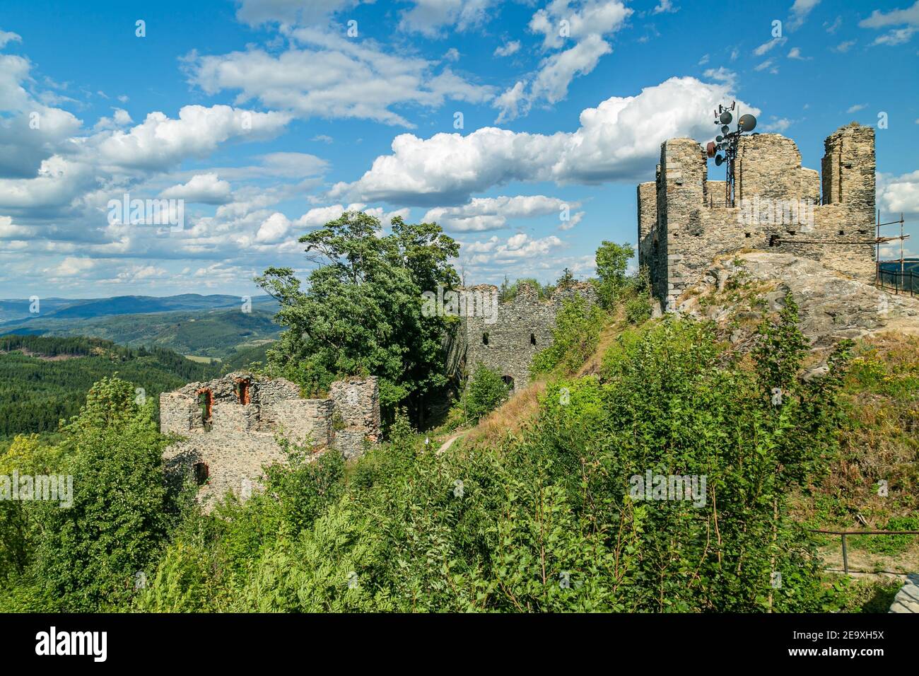 Andelska hora, Czech Republic - August 11 2018: Remains of the stone castle from 15th century standing on a hill with green trees, a scenic view. Stock Photo