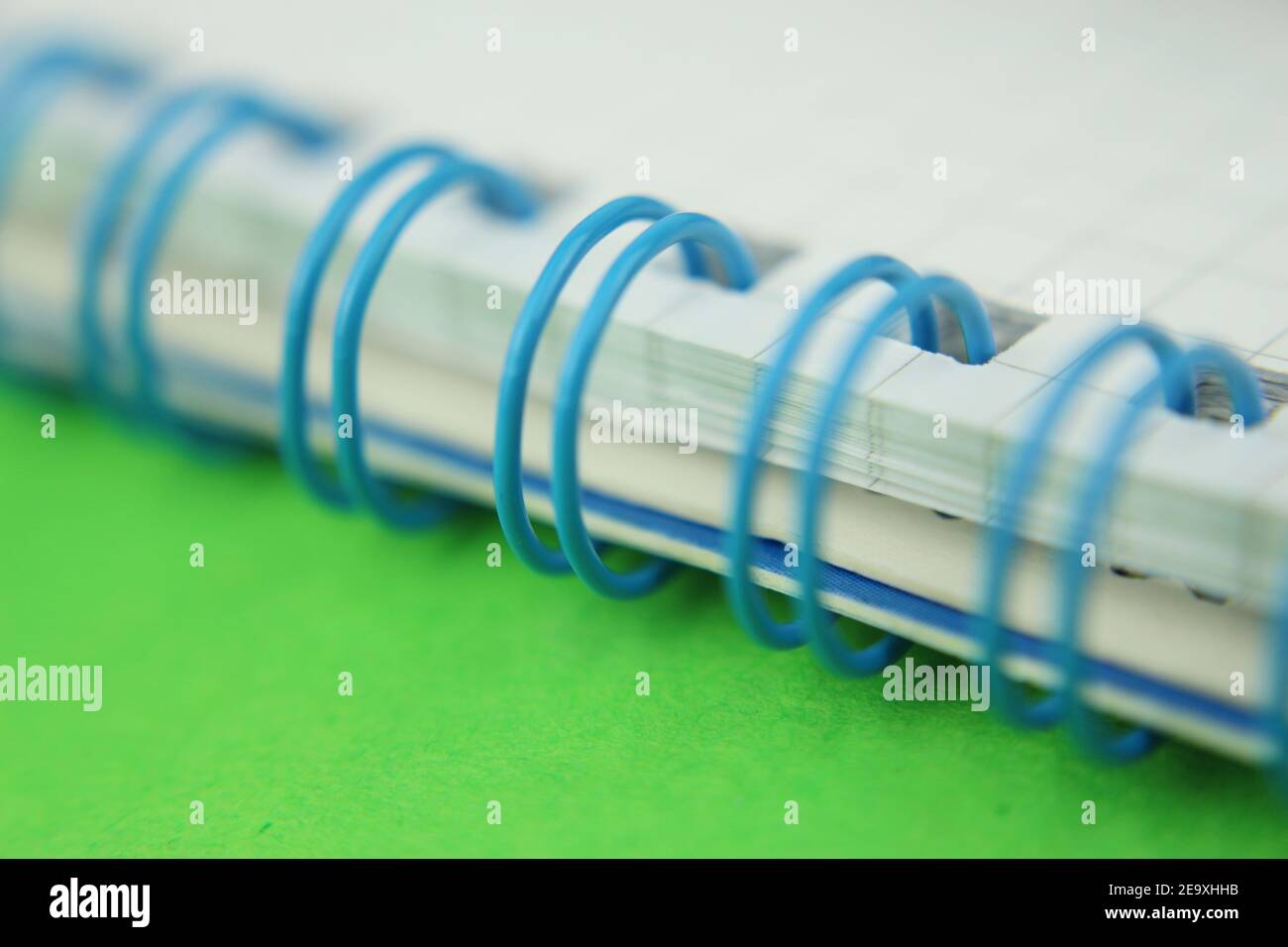 Spiral binder, notebook isolated, foreground, green background Stock Photo
