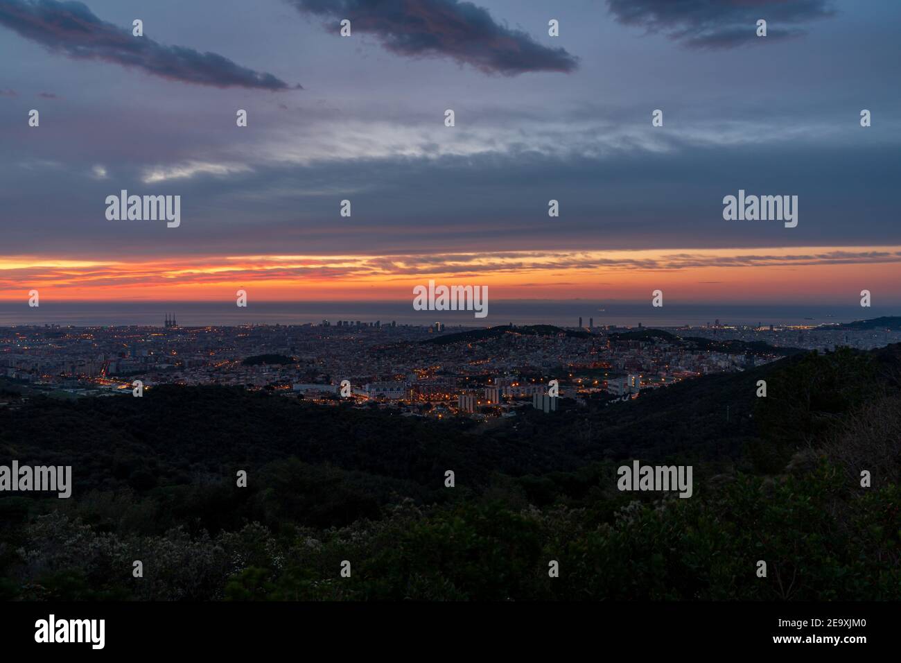 Sunrise On A Spring Day In The City Of Barcelona We Can See The Sky With Some Clouds That Light Up Like Fire With The Sunlight Mediterranean Sea Stock Photo Alamy
