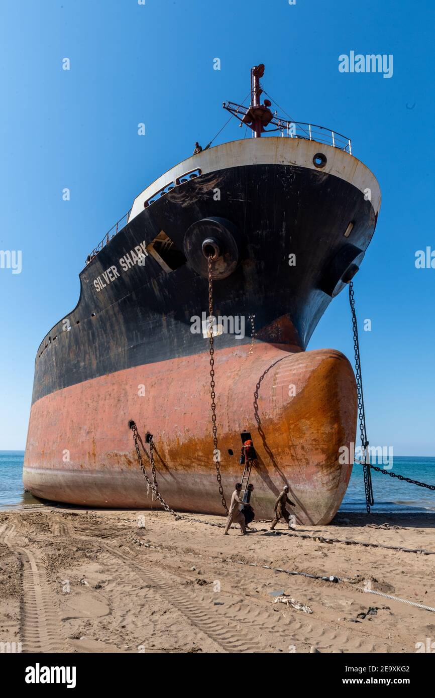 Ship being broken up at Gadani shipbreaking yard, located across a 10