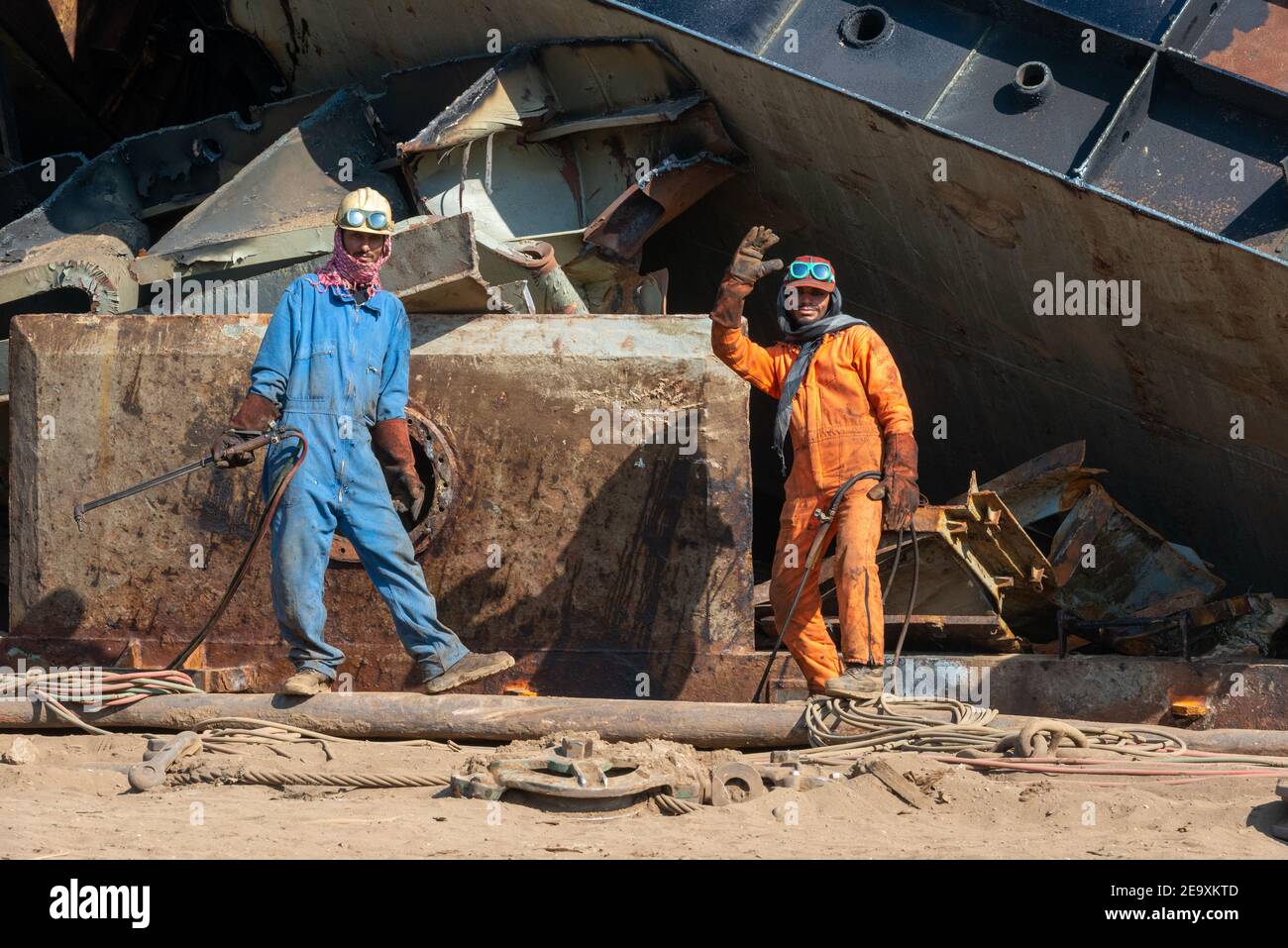 Workers breaking up ships, Gadani shipbreaking yard, located across a