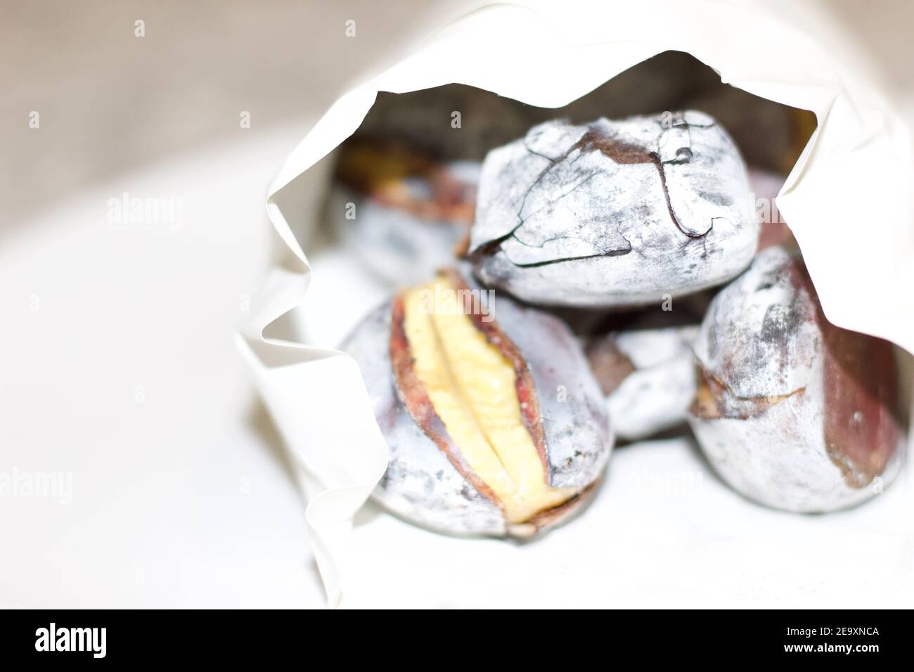 Roasted chestnuts on white plate Stock Photo