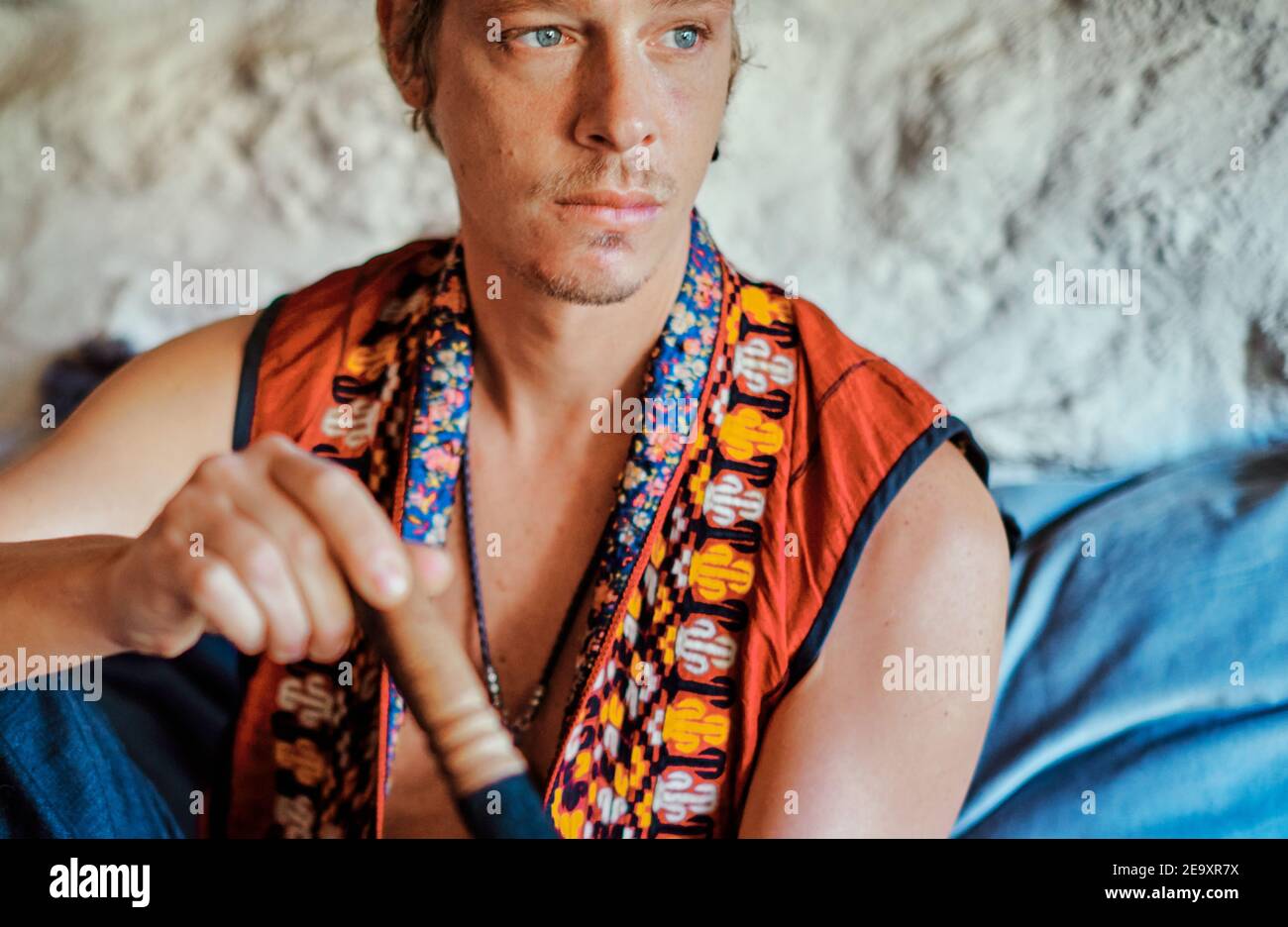Blond man practicing meditation at home Stock Photo