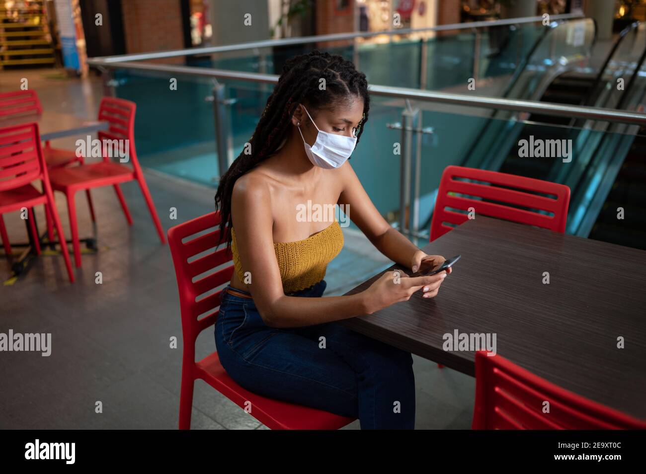 Woman wearing black facemask hi-res stock photography and images - Alamy
