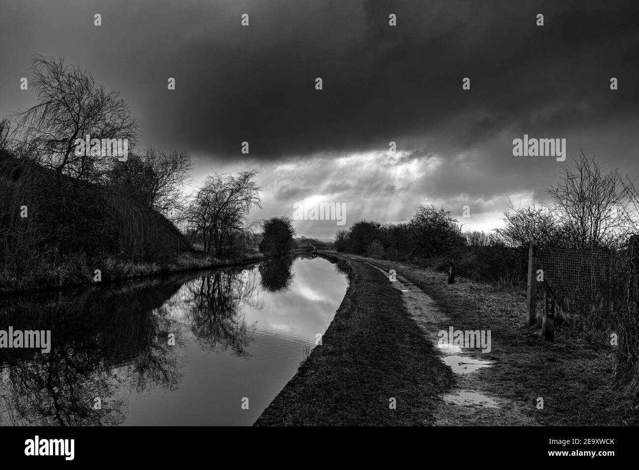 Black and White, Trent and Mersey canal with towpath in Moston near Sandbach Cheshire UK Stock Photo