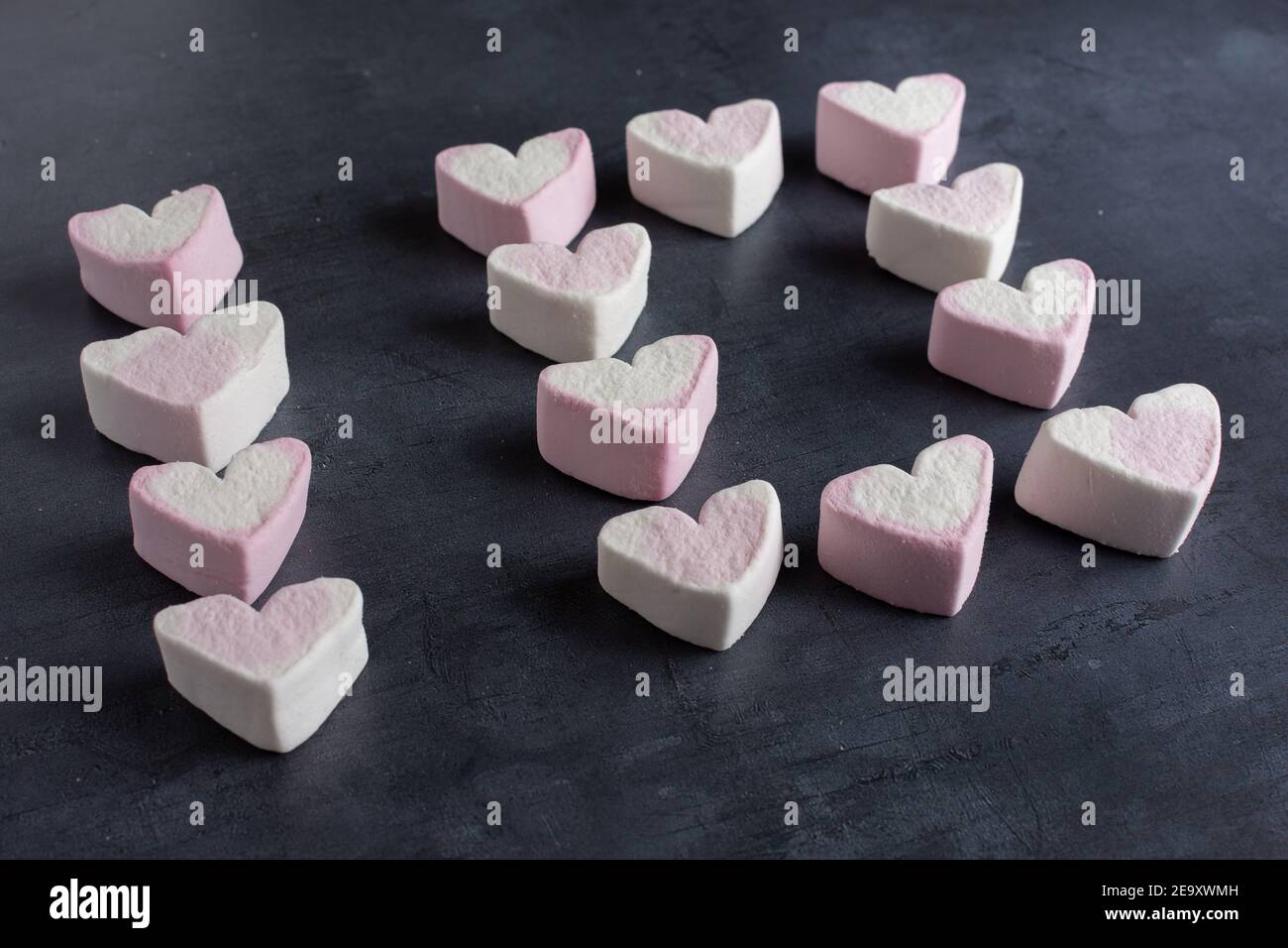 Love heart marshmallows lined up to spell out the number ten viewed