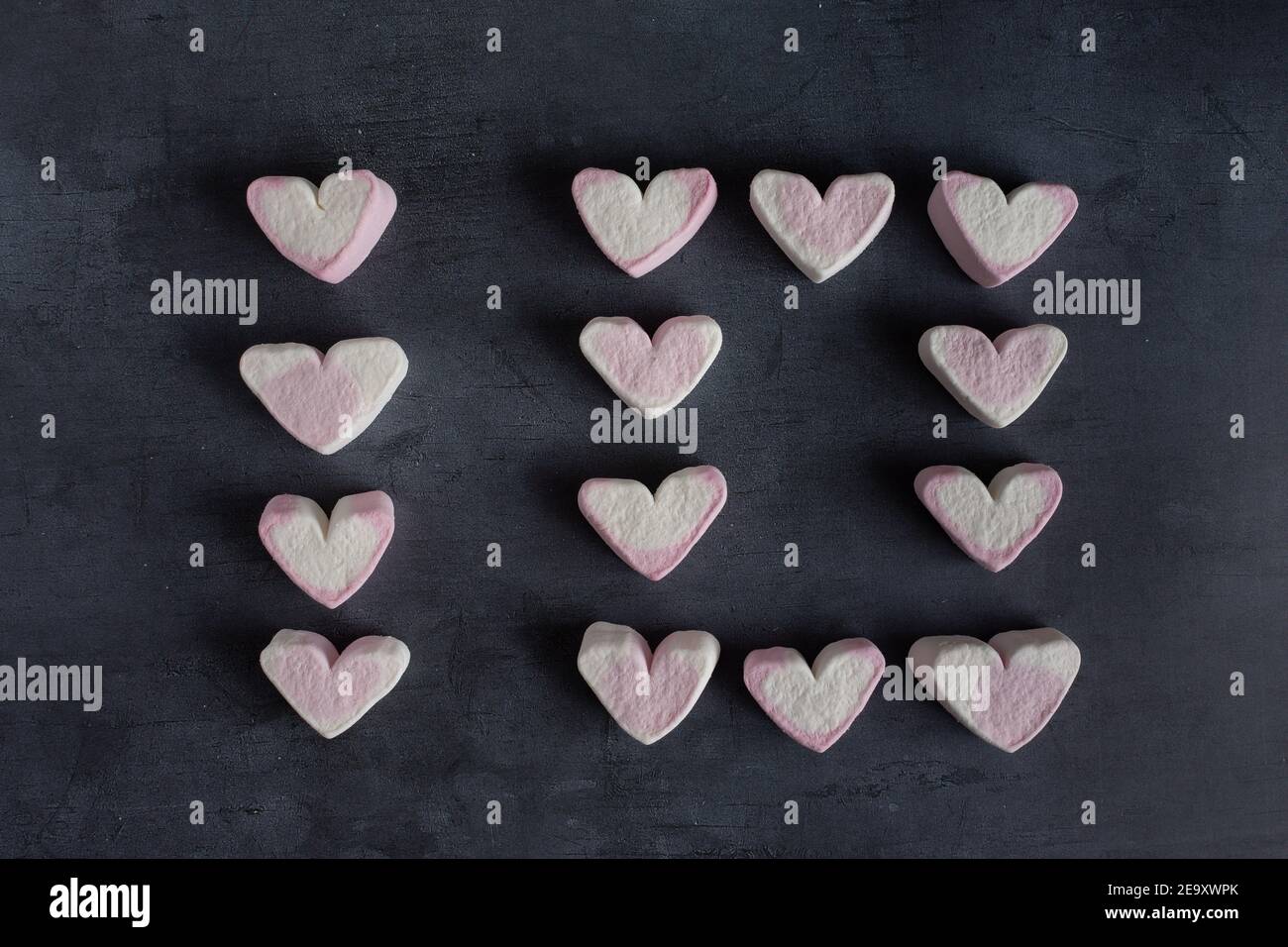 Love heart marshmallows lined up to spell out the number ten viewed from the top down Stock Photo