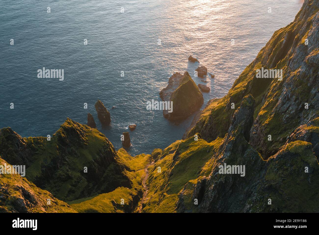 Aerial view of Suduroy cliffs, the southernmost of the Faroe Islands with blue sky on a sunn day. Stock Photo