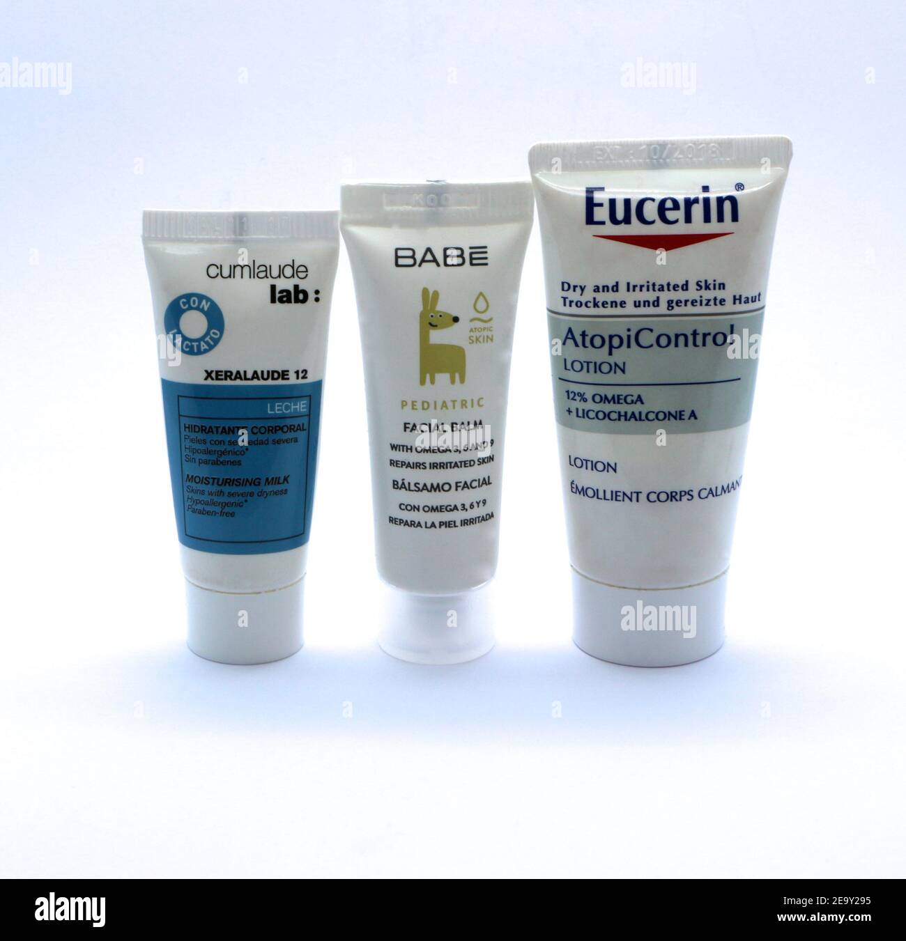 Photo of Three tubes of moisturising milk cream lotion for irritated or dry  skin standing in a row on a white background Eucerin Babe Xeralaude 12  Stock Photo - Alamy