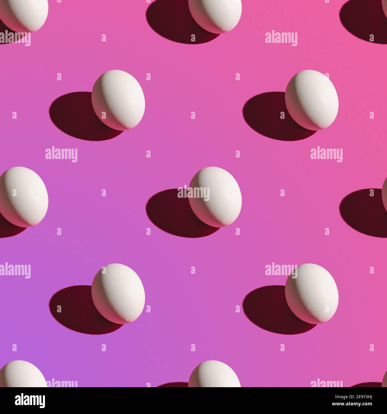White eggs pattern on purple gradient background Stock Photo