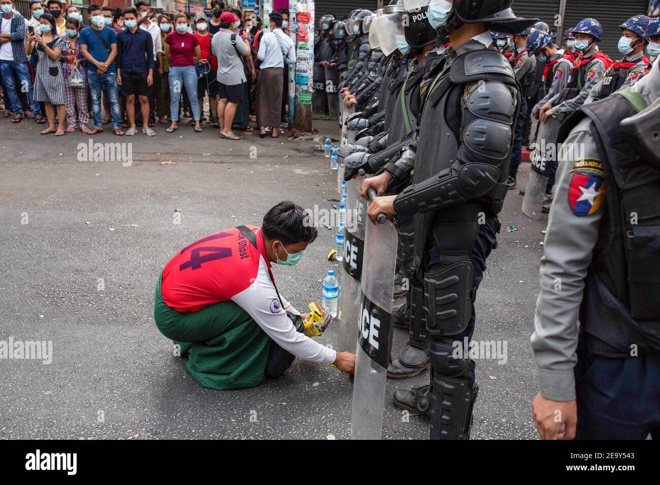 Yangon Myanmar 06th Feb 21 A Protester Gives Water Bottle To Police Officers During A Demonstration Against The Military Coup Massive Crowd Of The Streets Of Yangon To Protest Against The Coup And