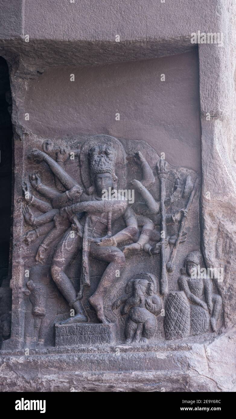 Badami, Karnataka, India - November 7, 2013: Cave temples above Agasthya Lake. Closeup of gray stone sculpture showing Nataraja or dancing Shiva. Heav Stock Photo