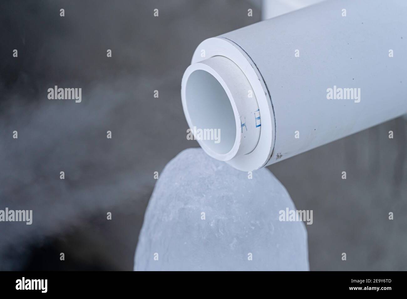 Furnace exhaust pipe blowing out steam in winter Stock Photo