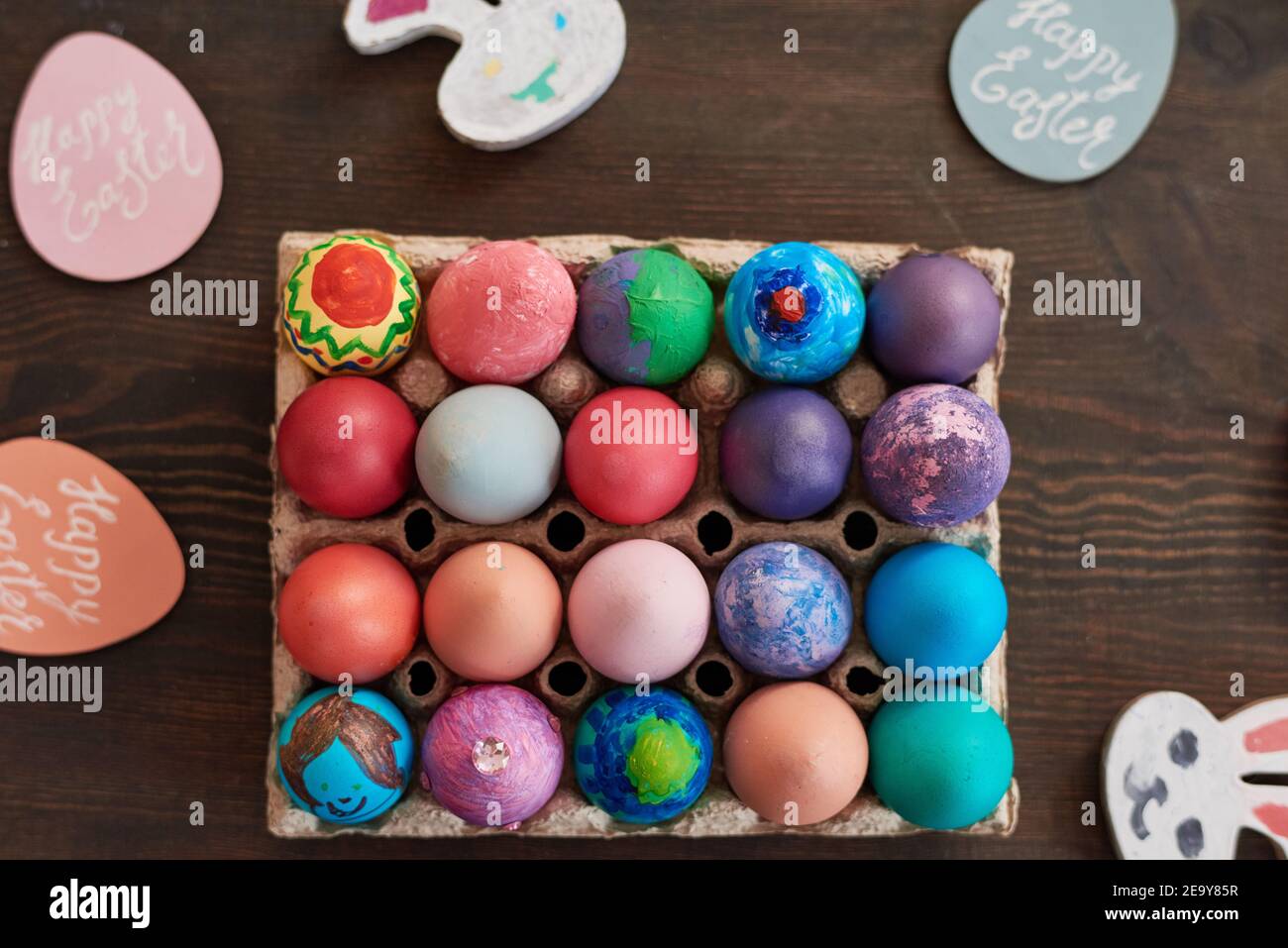 High angle view of colorful handmade easter eggs on the wooden table Stock Photo