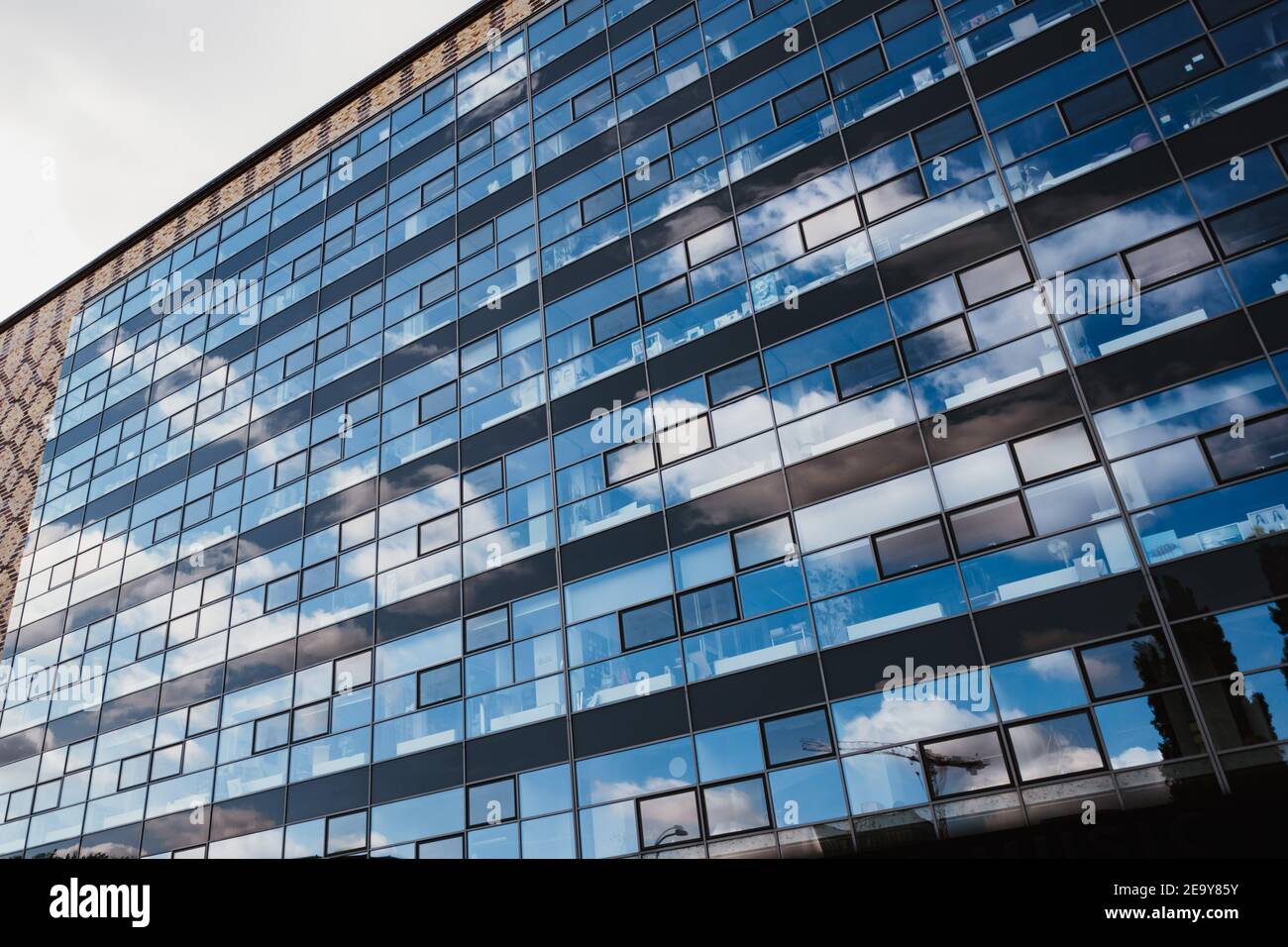 photo of sky reflection on a modern building facade Stock Photo - Alamy