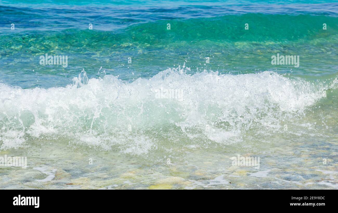 Pibble Wave Sea wave and pebble. Summer vacation concept. Sea wave with foam ...