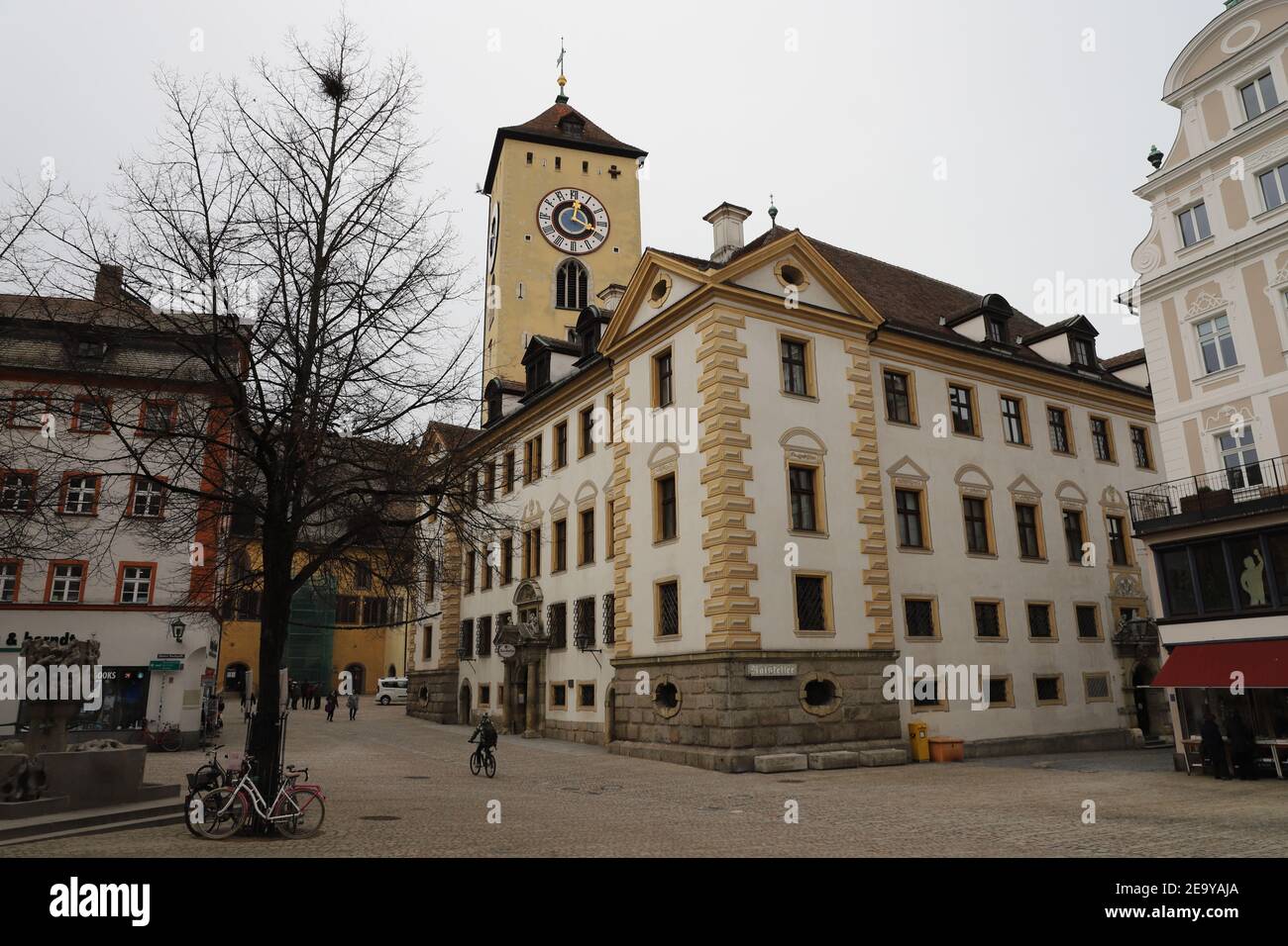 GERMANY, REGENSBURG, FEBRUARY 01, 2019: Kohlenmarkt with Old Town Hall Tower and Ratskeller Stock Photo
