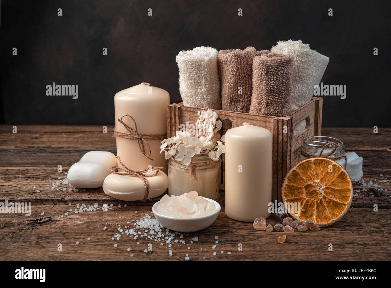 Spa composition with body care items on a brown background. Stock Photo