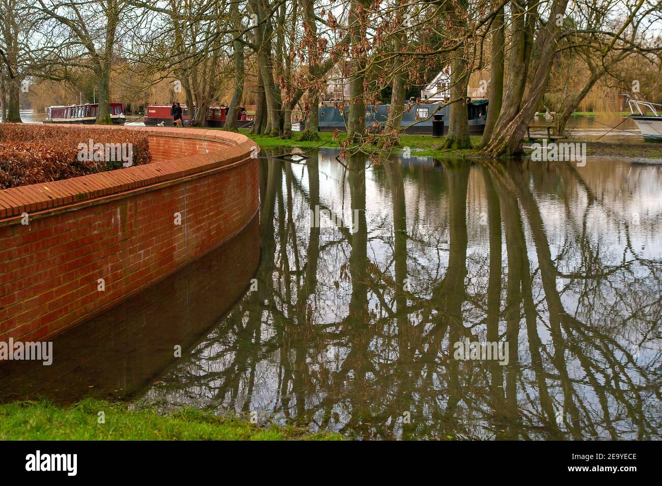 Cookham, Berkshire, UK. 6th February, 2021. A wall stops flooding getting into the grounds of a care home by the River Thames in Cookham. A Flood Alert remains in force along the stretch of the River Thames from Hurley to Cookham. The Pound across Cookham Moor flooded earlier this week and remains closed to traffic following flooding. The flood water levels have lessened, however, further rain is expected overnight together with possible snow and the Environment Agency are closely monitoring the situation. Credit: Maureen McLean/Alamy Live News Stock Photo