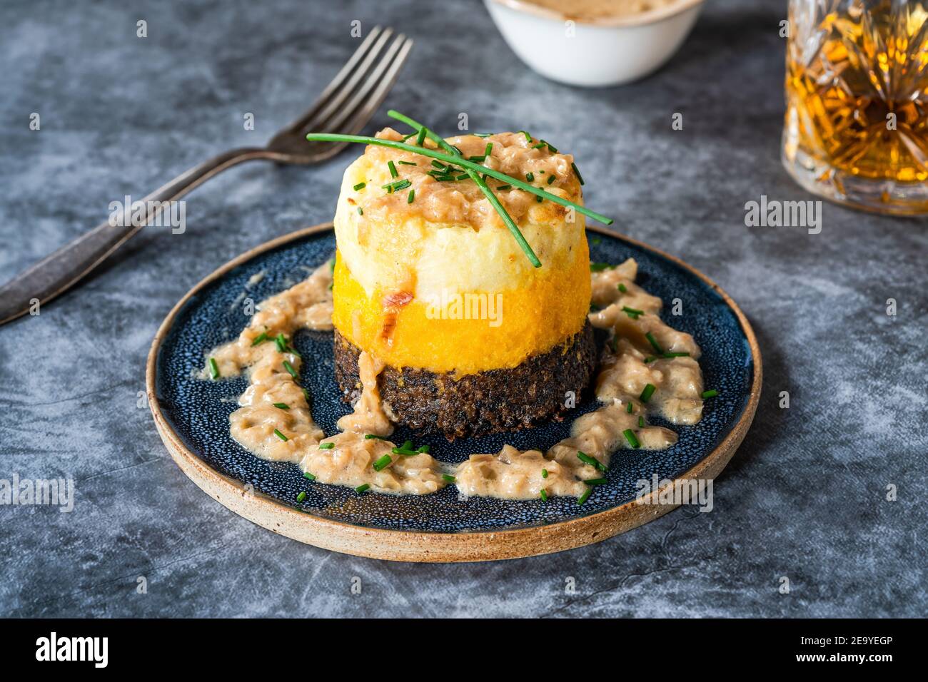 Haggis, neeps and tatties stack (haggis with turnips and potatoes) with ...