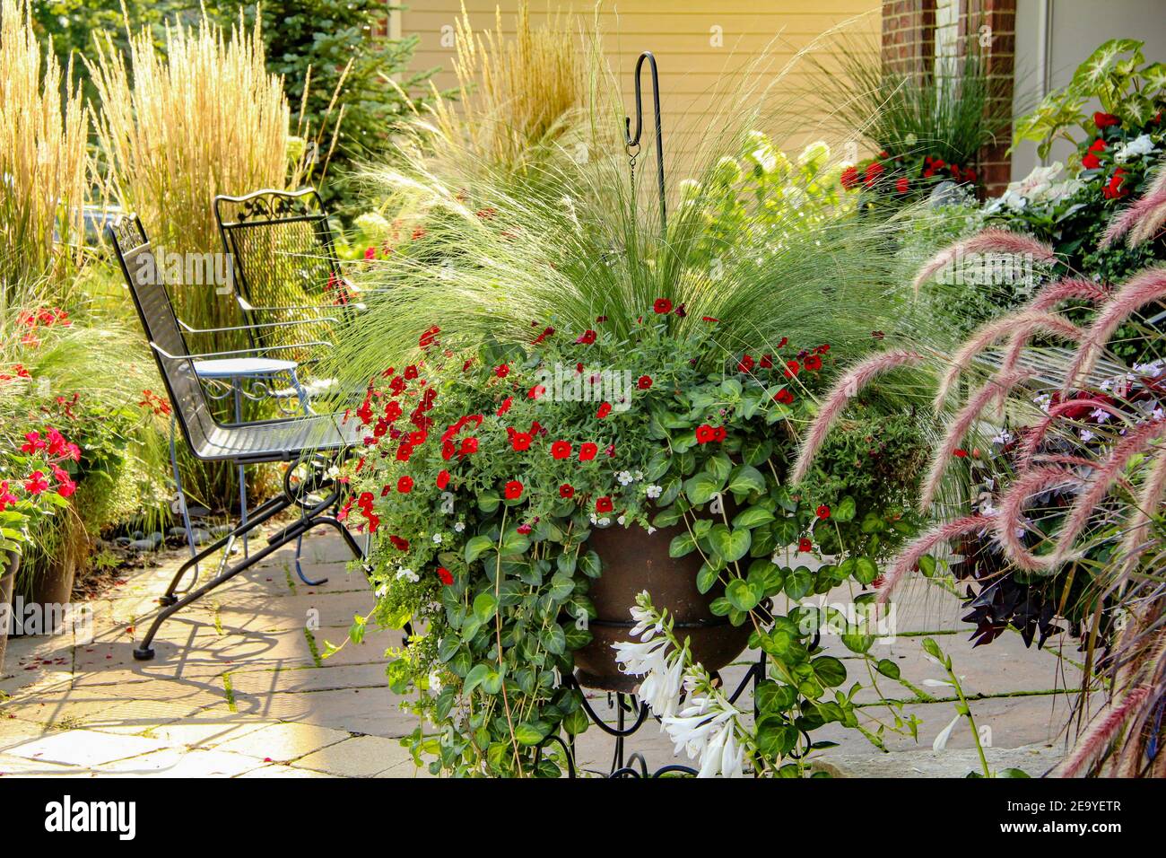 A quiet peaceful sunny morning In the summer on a Flower filled patio in a residential neighborhood of Chicago. Stock Photo