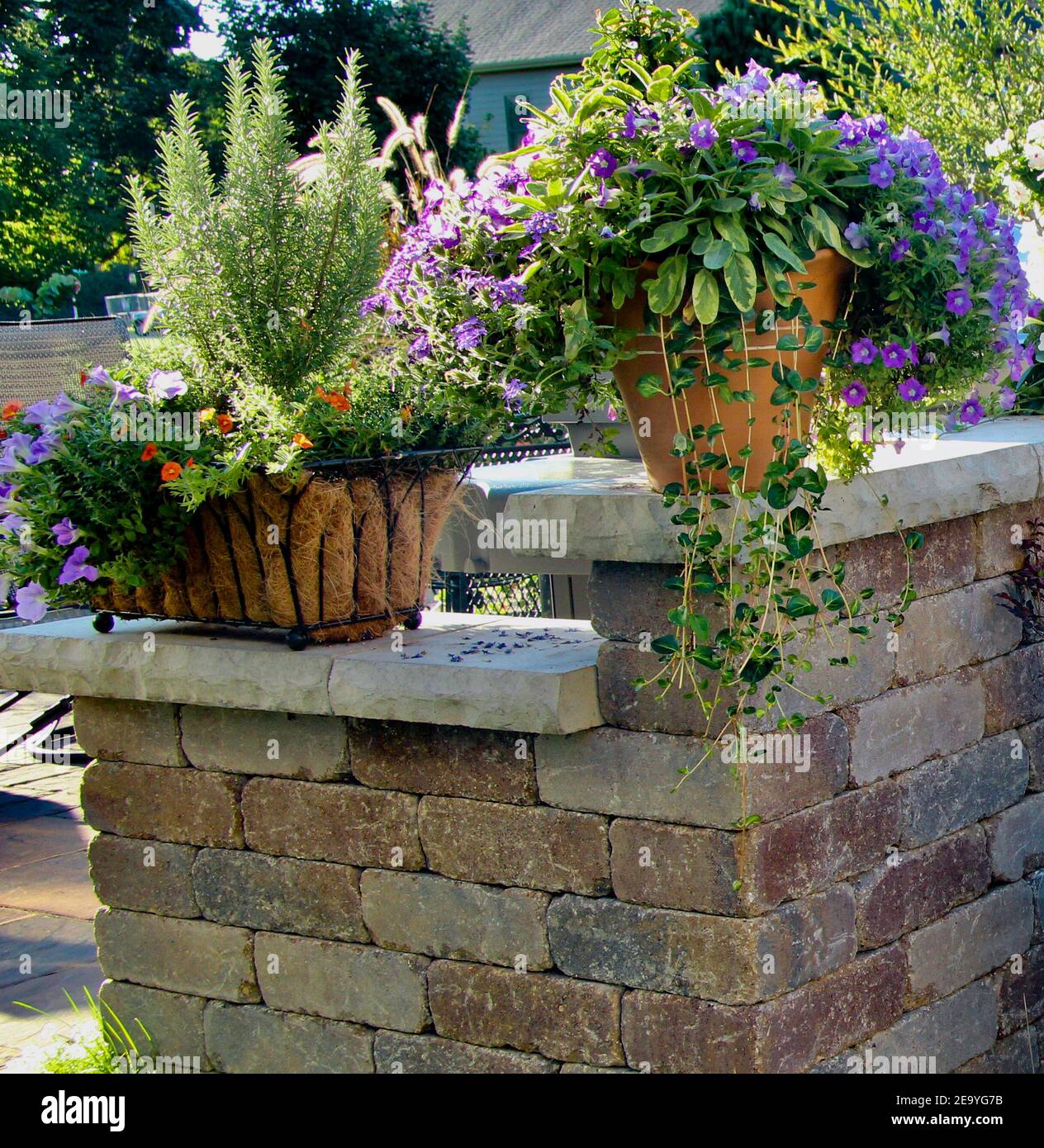 horizontal picture of a retaining wall with capstone ledges wide enough to hold terra cotta
