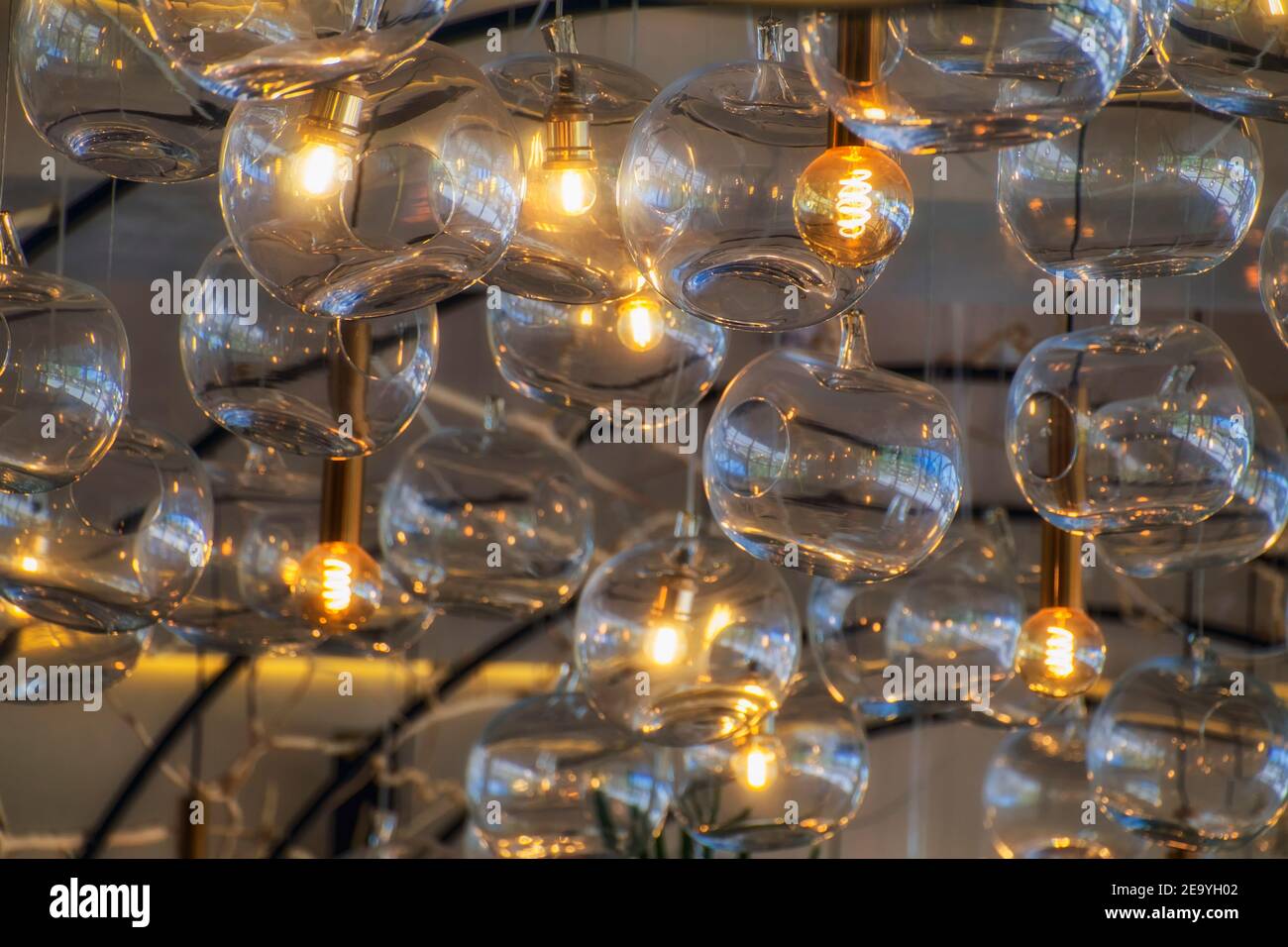 Burning and non-burning lamps in round plafonds Stock Photo