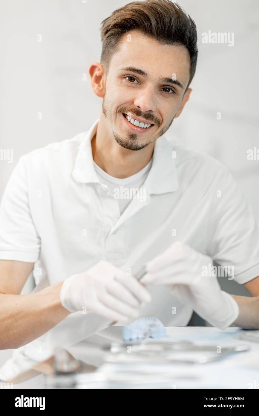 Dental technician working with a model of teeth and dental braces Stock Photo Alamy