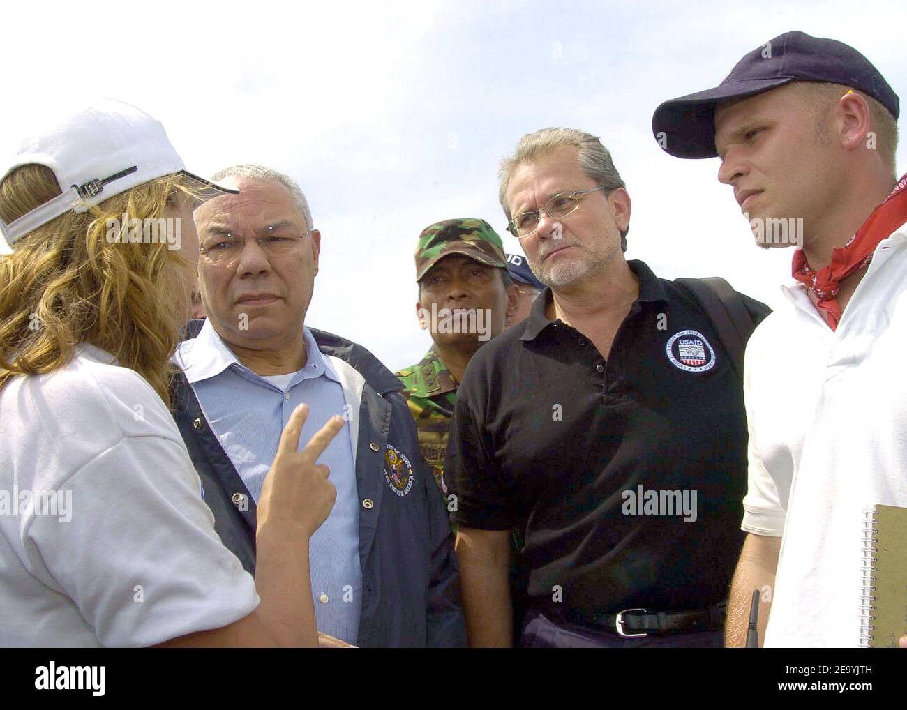 Secretary of State Colin Powell talks with relief aid workers during a tour of the Banda Ache, Sumatra, Indonesia airport. Medical teams from USS Abraham Lincoln (CVN 72), Carrier Air Wing Two (CVW-2) and the International Organization for Migration (IOM) set-up a triage site located on Sultan Iskandar Muda Air Force Base, in Banda Aceh, Sumatra. The two teams worked together with members of the Australian Air Force to provide initial medical care to victims of the Tsunami-stricken coastal regions. Photo by Seth C. Peterson/USN via ABACA. Stock Photo