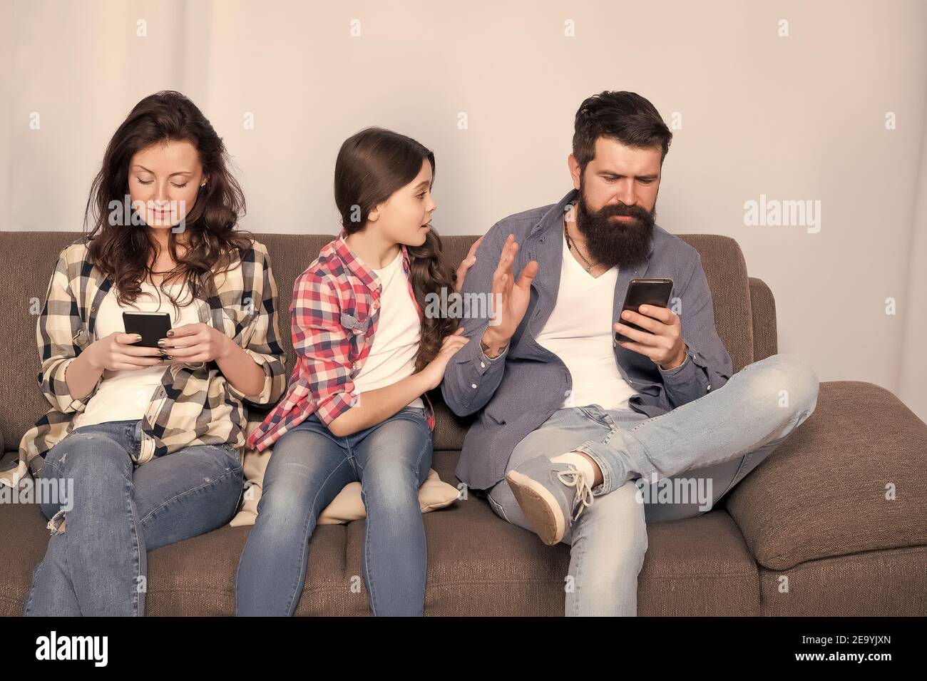 Dad and mom ignoring daughter needs. Bad habits. Parenthood failure