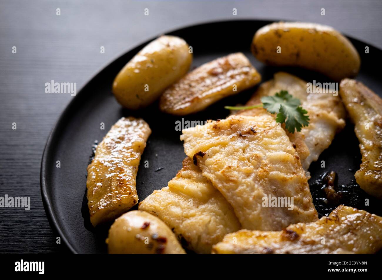 Flounder meuniere style with fried banana Stock Photo Alamy