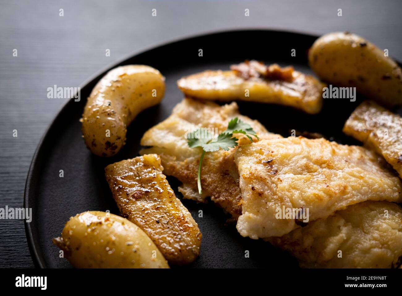 Flounder meuniere style with fried banana Stock Photo Alamy