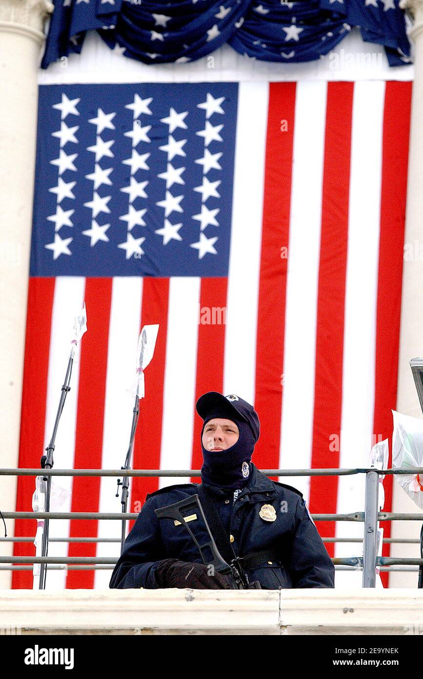 Police officer on the steps of the Capitol watching the rehearsal of ...