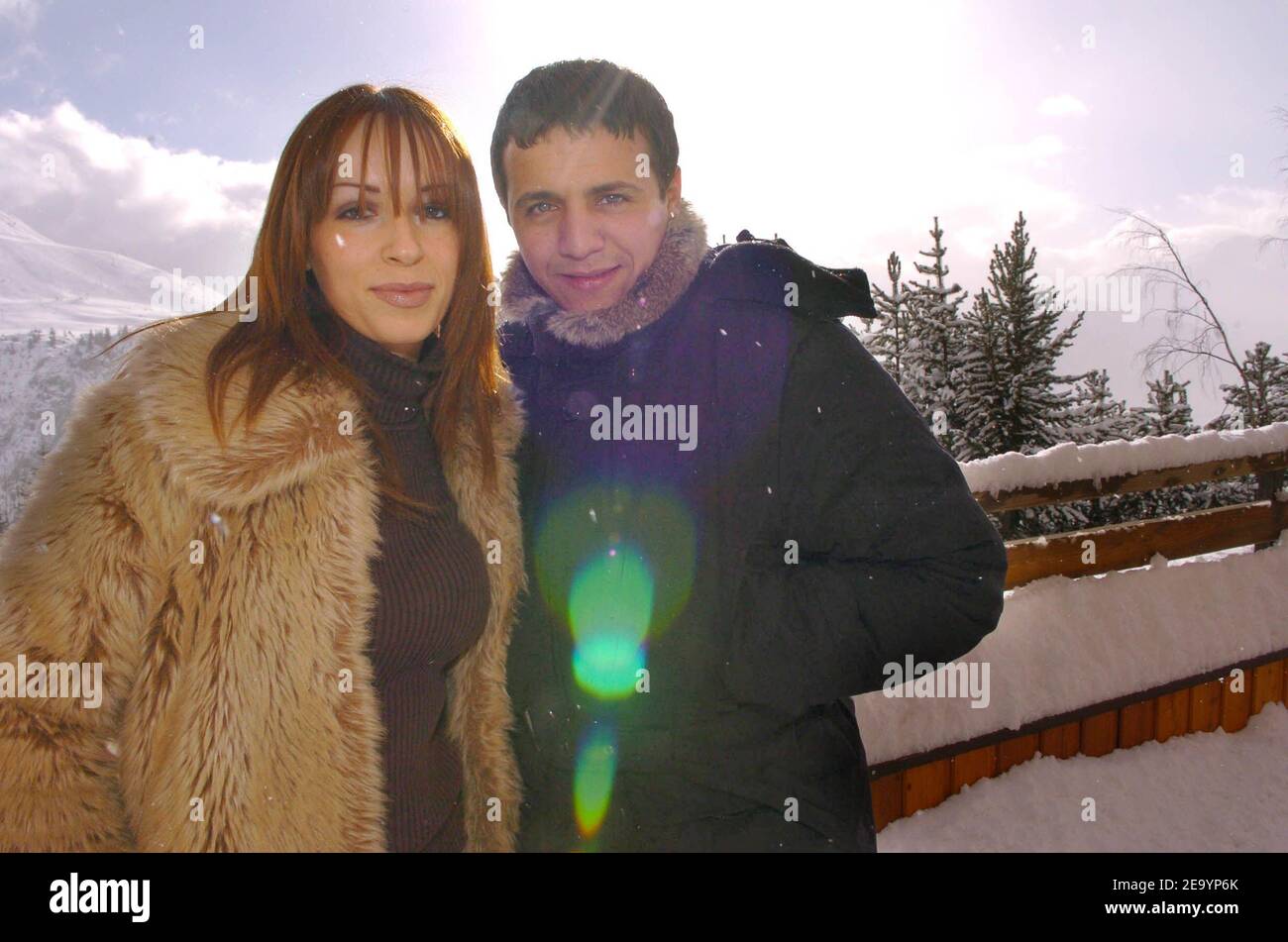 French rai singer and actor Faudel poses with his girlfriend Anissa at a photocall for his movie 'Bab El Web' directed by Merzak Allouache during the 'Festival du Film de Comedie' in l'Alpe d'Huez, France on January 19, 2005. Photo by Bruno Klein/ABACA. Stock Photo
