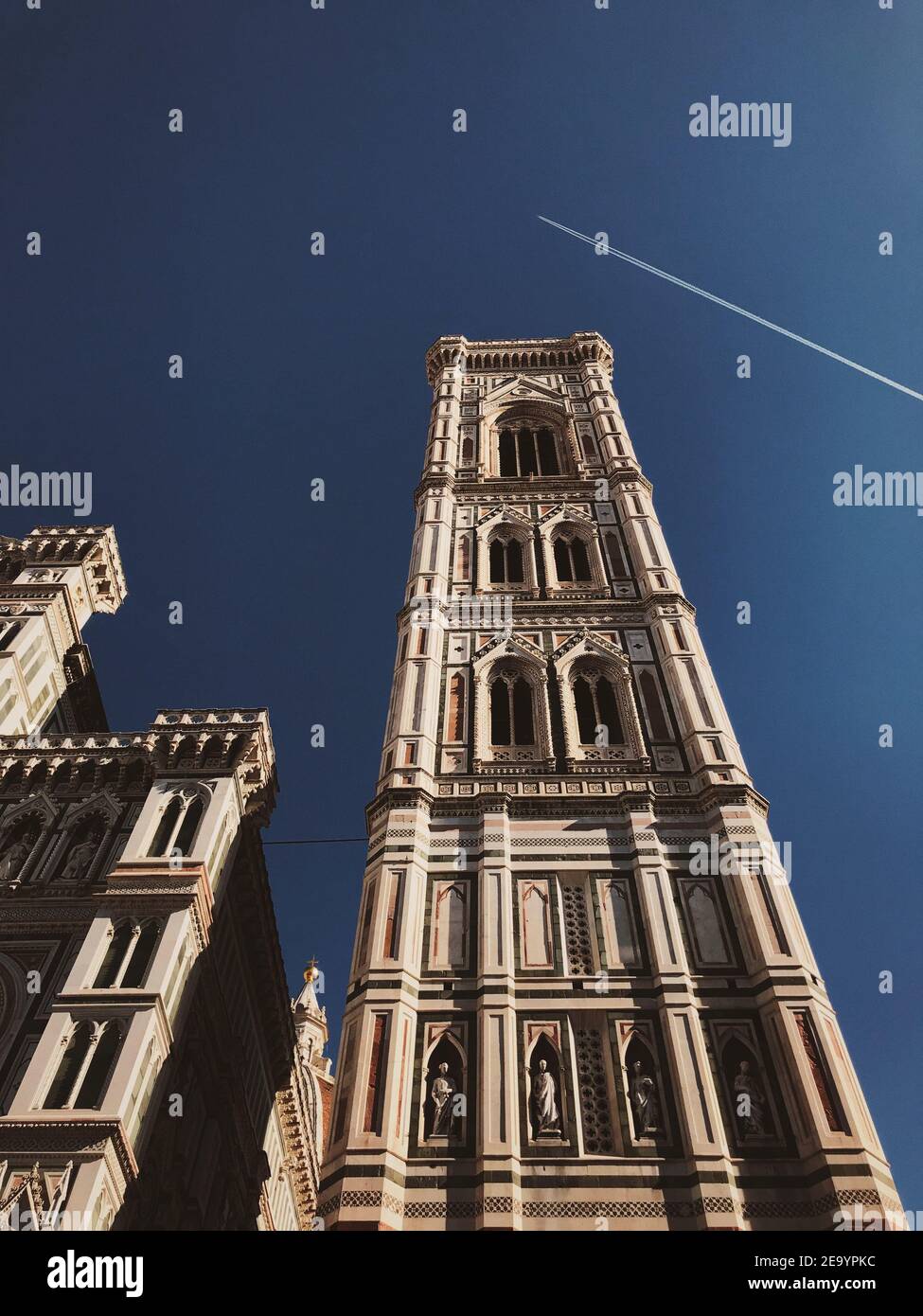 Low angle vertical shot of ancient historical buildings under a clear ...
