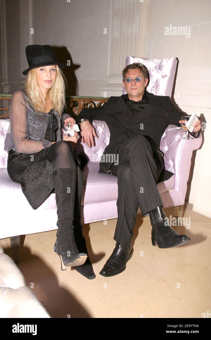 French TV presenter Olivia Adriaco and her boyfriend Cecil attend the  Haute-Couture Ball organized by Lebanese fashion designer Elie Saab at La  Maison Baccarat in Paris, France, on January 24, 2005. Photo